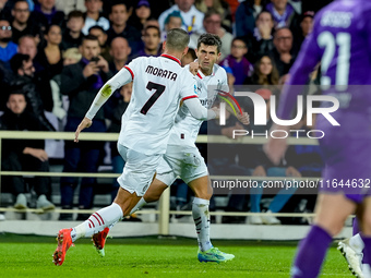 Christian Pulisic of AC Milan celebrates after scoring first goal during the Serie A Enilive match between ACF Fiorentina and AC Milan at St...