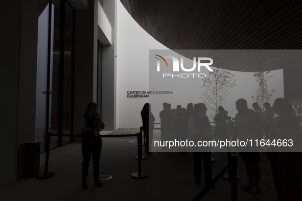 In Lisbon, Portugal, on October 6, 2024, people wait to enter the new Center for Modern Art. CAM is an art and culture center with a collect...