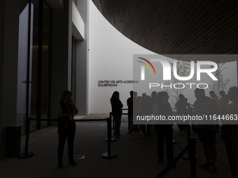 In Lisbon, Portugal, on October 6, 2024, people wait to enter the new Center for Modern Art. CAM is an art and culture center with a collect...