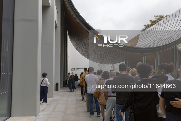 In Lisbon, Portugal, on October 6, 2024, people wait to enter the new Center for Modern Art. CAM is an art and culture center with a collect...