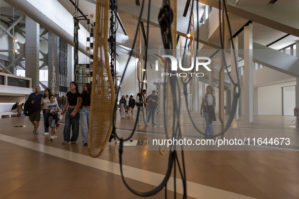 People are seen inside the new Center for Modern Art in Lisbon, Portugal, on October 6, 2024. CAM is an art and culture center with a collec...