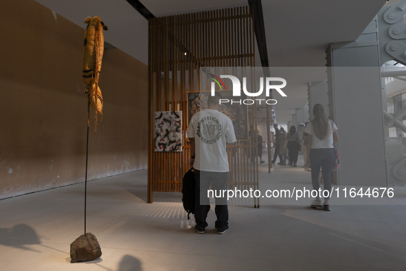 People look at art inside the new Center for Modern Art in Lisbon, Portugal, on October 6, 2024. CAM is an art and culture center with a col...