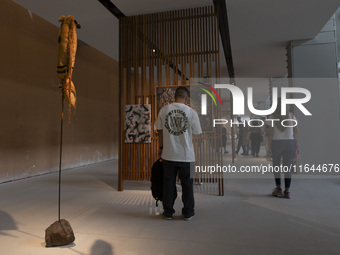 People look at art inside the new Center for Modern Art in Lisbon, Portugal, on October 6, 2024. CAM is an art and culture center with a col...