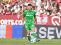 Marc Roca of Real Betis passes the ball during the La Liga EA Sports match between Sevilla FC and Real Betis at Sanchez Pizjuan in Seville,...