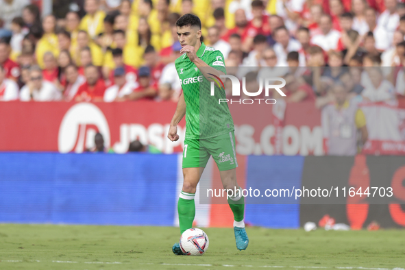 Marc Roca of Real Betis passes the ball during the La Liga EA Sports match between Sevilla FC and Real Betis at Sanchez Pizjuan in Seville,...