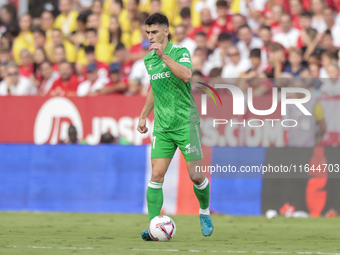 Marc Roca of Real Betis passes the ball during the La Liga EA Sports match between Sevilla FC and Real Betis at Sanchez Pizjuan in Seville,...