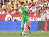 Marc Roca of Real Betis passes the ball during the La Liga EA Sports match between Sevilla FC and Real Betis at Sanchez Pizjuan in Seville,...