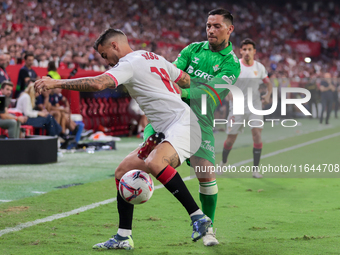 Jesus Joaquin Fernandez ''Suso'' of Sevilla FC competes for the ball with Chimy Avila of Real Betis during the La Liga EA Sports match betwe...