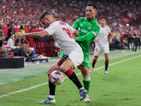 Jesus Joaquin Fernandez ''Suso'' of Sevilla FC competes for the ball with Chimy Avila of Real Betis during the La Liga EA Sports match betwe...