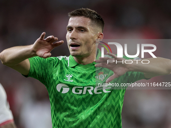 Romain Perraud of Real Betis argues with the referee during the La Liga EA Sports match between Sevilla FC and Real Betis at Sanchez Pizjuan...