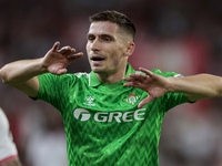 Romain Perraud of Real Betis argues with the referee during the La Liga EA Sports match between Sevilla FC and Real Betis at Sanchez Pizjuan...