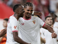 Loic Bade of Sevilla FC and Dodi Lukebakio of Sevilla FC celebrate winning during the La Liga EA Sports match between Sevilla FC and Real Be...