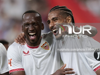 Loic Bade of Sevilla FC and Dodi Lukebakio of Sevilla FC celebrate winning during the La Liga EA Sports match between Sevilla FC and Real Be...