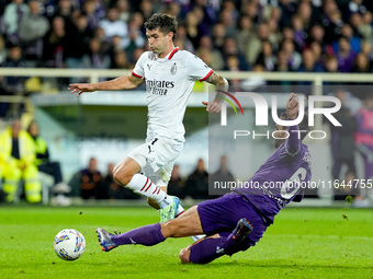 Luca Ranieri of ACF Fiorentina and Christian Pulisic of AC Milan compete for the ball during the Serie A Enilive match between ACF Fiorentin...