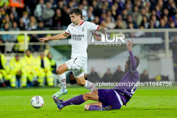 Luca Ranieri of ACF Fiorentina and Christian Pulisic of AC Milan compete for the ball during the Serie A Enilive match between ACF Fiorentin...