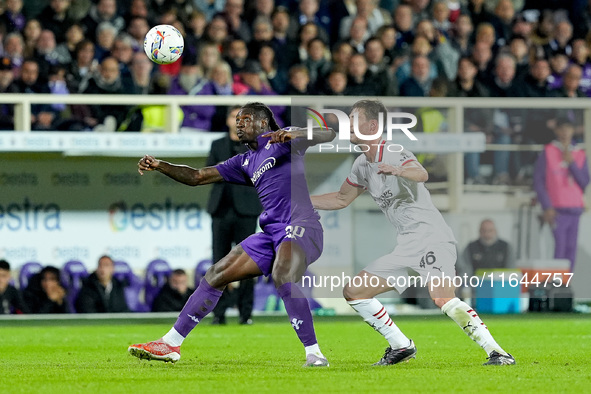 Moise Kean of ACF Fiorentina and Matteo Gabbia of AC Milan compete for the ball during the Serie A Enilive match between ACF Fiorentina and...