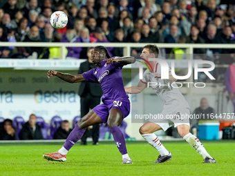 Moise Kean of ACF Fiorentina and Matteo Gabbia of AC Milan compete for the ball during the Serie A Enilive match between ACF Fiorentina and...