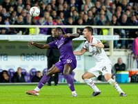 Moise Kean of ACF Fiorentina and Matteo Gabbia of AC Milan compete for the ball during the Serie A Enilive match between ACF Fiorentina and...