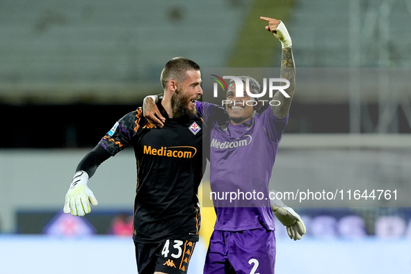 Dodo of ACF Fiorentina celebrates with David De Gea after Albert Gudmundsson scored second goal during the Serie A Enilive match between ACF...