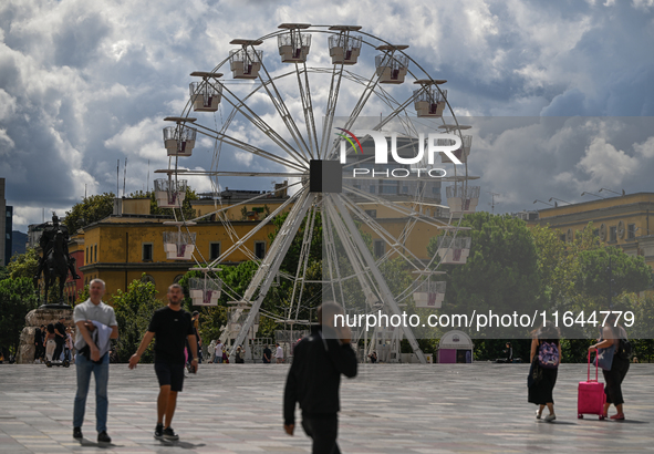 TIRANA, ALBANIA - SEPTEMBER 16:   
A Ferris wheel in Tirana, next to the Skanderbeg Monument in the Skanderbeg Square, seen on September 16,...