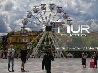 TIRANA, ALBANIA - SEPTEMBER 16:   
A Ferris wheel in Tirana, next to the Skanderbeg Monument in the Skanderbeg Square, seen on September 16,...