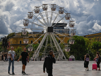 TIRANA, ALBANIA - SEPTEMBER 16:   
A Ferris wheel in Tirana, next to the Skanderbeg Monument in the Skanderbeg Square, seen on September 16,...