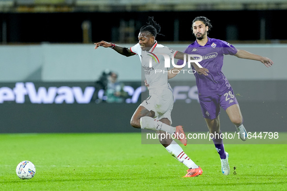 Yacine Adly of ACF Fiorentina and Rafael Leao of AC Milan compete for the ball during the Serie A Enilive match between ACF Fiorentina and A...