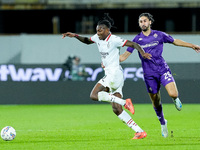 Yacine Adly of ACF Fiorentina and Rafael Leao of AC Milan compete for the ball during the Serie A Enilive match between ACF Fiorentina and A...