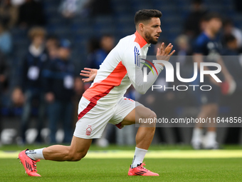 Alex Moreno of Nottingham Forest warms up ahead of kick-off during the Premier League match between Chelsea and Nottingham Forest at Stamfor...