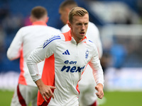 James Ward-Prowse of Nottingham Forest warms up ahead of kick-off during the Premier League match between Chelsea and Nottingham Forest at S...