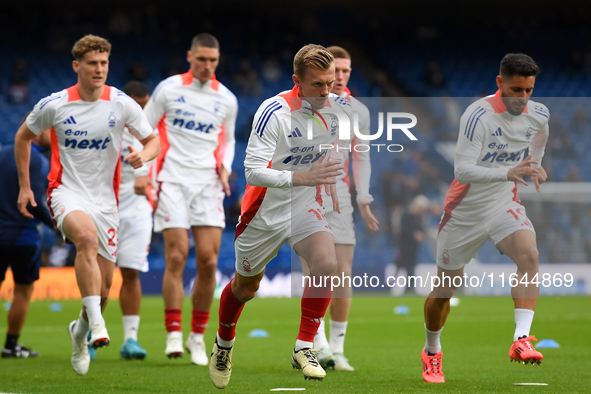 James Ward-Prowse of Nottingham Forest warms up ahead of kick-off during the Premier League match between Chelsea and Nottingham Forest at S...