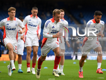 James Ward-Prowse of Nottingham Forest warms up ahead of kick-off during the Premier League match between Chelsea and Nottingham Forest at S...