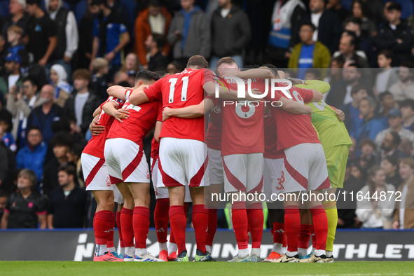 Forest players form a huddle before the Premier League match between Chelsea and Nottingham Forest at Stamford Bridge in London, England, on...