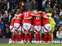 Forest players form a huddle before the Premier League match between Chelsea and Nottingham Forest at Stamford Bridge in London, England, on...