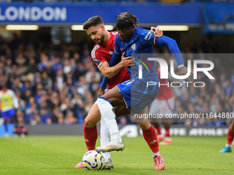 Alex Moreno of Nottingham Forest battles with Noni Madueke of Chelsea during the Premier League match between Chelsea and Nottingham Forest...