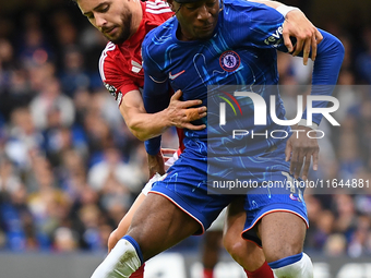 Alex Moreno of Nottingham Forest battles with Noni Madueke of Chelsea during the Premier League match between Chelsea and Nottingham Forest...