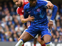 Alex Moreno of Nottingham Forest battles with Noni Madueke of Chelsea during the Premier League match between Chelsea and Nottingham Forest...