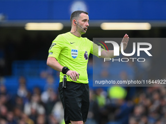 Referee Chris Kavanagh gestures during the Premier League match between Chelsea and Nottingham Forest at Stamford Bridge in London, England,...