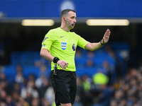 Referee Chris Kavanagh gestures during the Premier League match between Chelsea and Nottingham Forest at Stamford Bridge in London, England,...