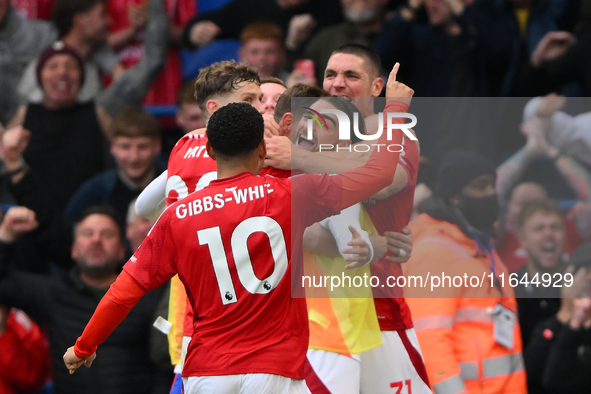 The Reds celebrate after Chris Wood of Nottingham Forest scores a goal to make it 0-1 during the Premier League match between Chelsea and No...