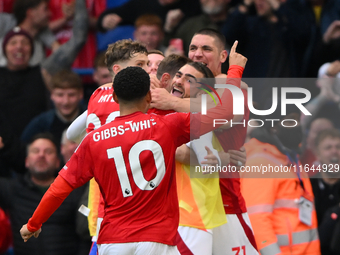 The Reds celebrate after Chris Wood of Nottingham Forest scores a goal to make it 0-1 during the Premier League match between Chelsea and No...