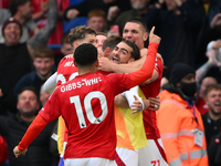 The Reds celebrate after Chris Wood of Nottingham Forest scores a goal to make it 0-1 during the Premier League match between Chelsea and No...