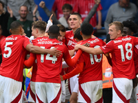 The Reds celebrate after Chris Wood of Nottingham Forest scores a goal to make it 0-1 during the Premier League match between Chelsea and No...