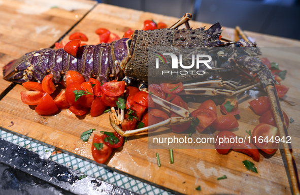 TIRANA, ALBANIA - SEPTEMBER 16:   
Preparation of a lobster in a local seafood restaurant, seen on September 16, 2024, in Tirana, Albania. 