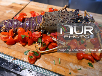 TIRANA, ALBANIA - SEPTEMBER 16:   
Preparation of a lobster in a local seafood restaurant, seen on September 16, 2024, in Tirana, Albania. (