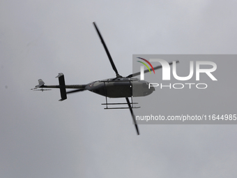 A helicopter guards Claudia Sheinbaum, President of Mexico, in Tizayuca, Hidalgo, on October 6, 2024, during the signing of the start of pre...