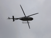 A helicopter guards Claudia Sheinbaum, President of Mexico, in Tizayuca, Hidalgo, on October 6, 2024, during the signing of the start of pre...