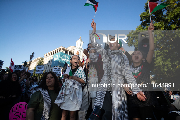 Children lead chants of ''Free Palestine'' during a demonstration demanding ceasefires in Palestine and Lebanon at the White House in Washin...