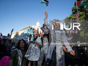 Children lead chants of ''Free Palestine'' during a demonstration demanding ceasefires in Palestine and Lebanon at the White House in Washin...