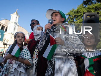 Children lead chants of ''Free Palestine'' during a demonstration demanding ceasefires in Palestine and Lebanon at the White House in Washin...